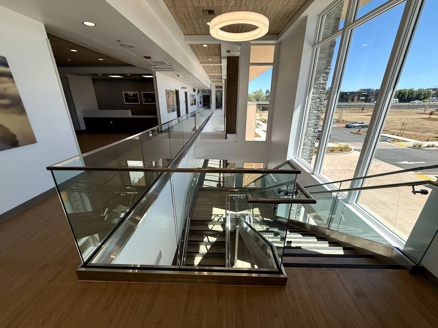 Glass mezzanine guardrail we installed overlooking the lobby of a Northern California health care building